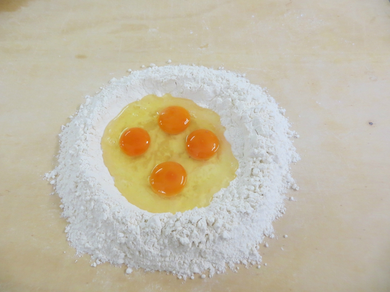 4 eggs in a flour well